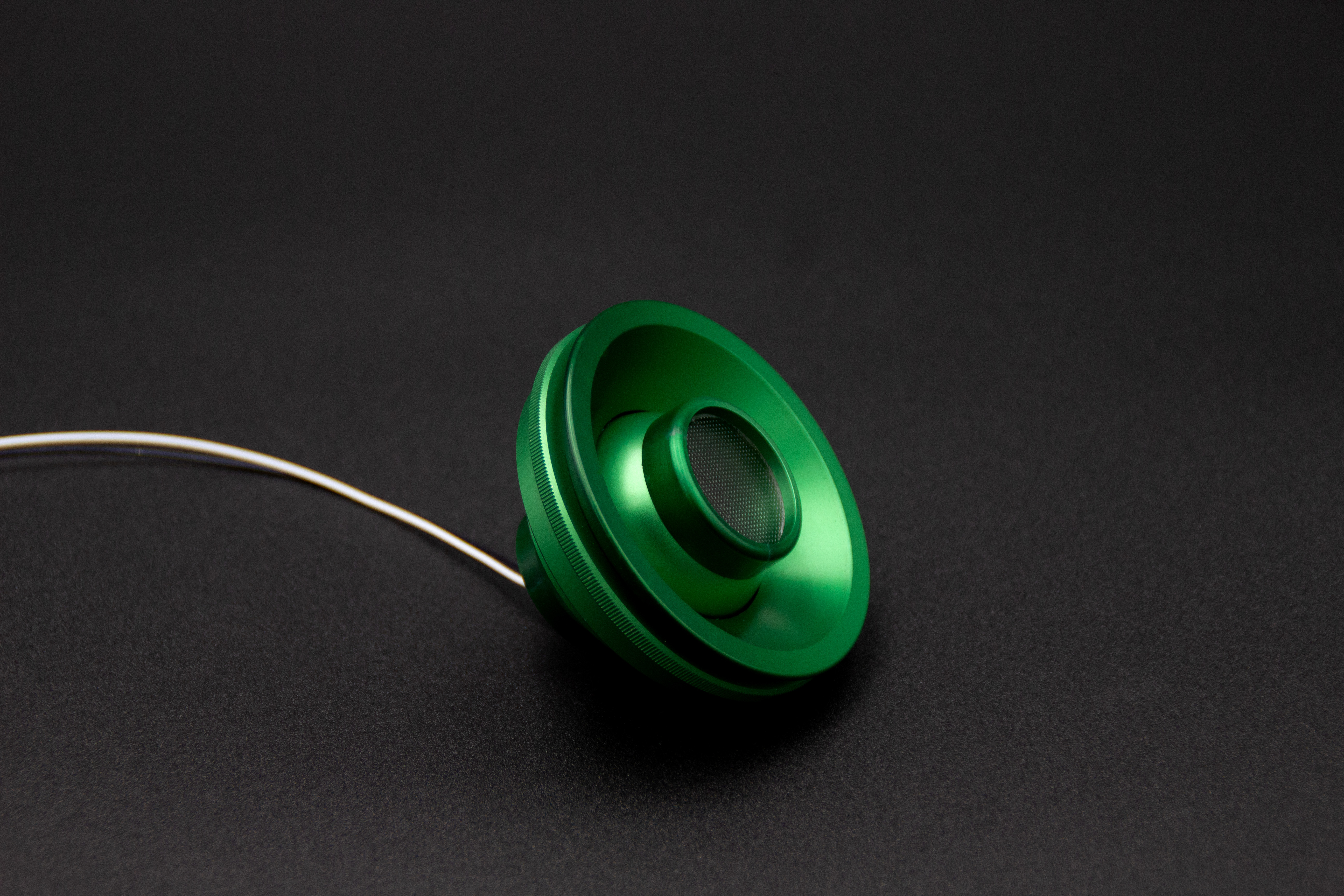 PWI custom LED reading light in green anodized finish, angled view showing mesh lens and cable