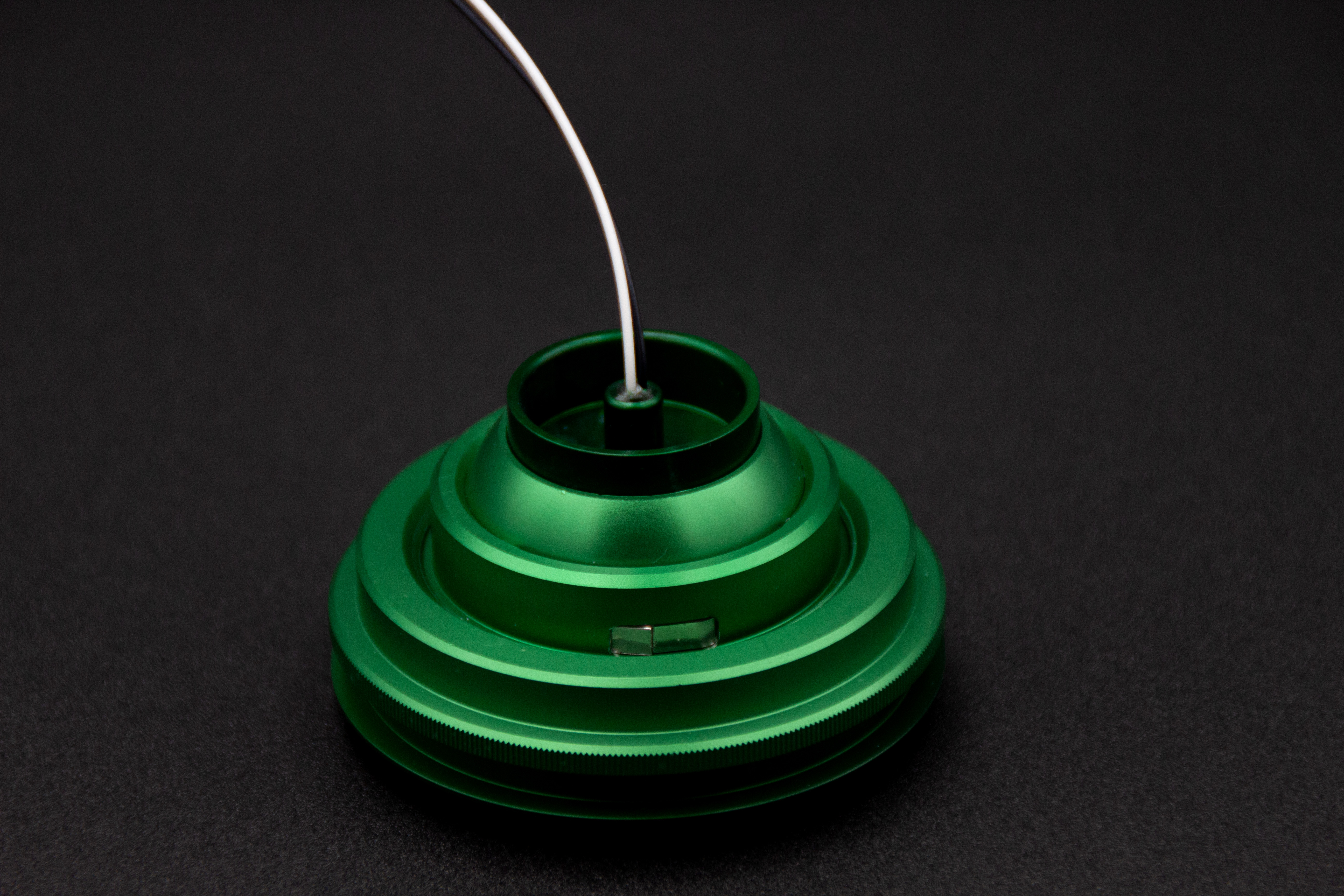 Top view of PWI custom LED reading light in green anodized finish showing cable entry and dimmer switch