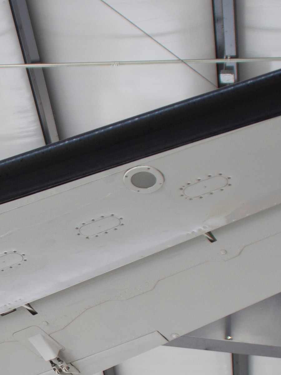PWI LED logo light &mdash; mounting hole on aircraft wing underside