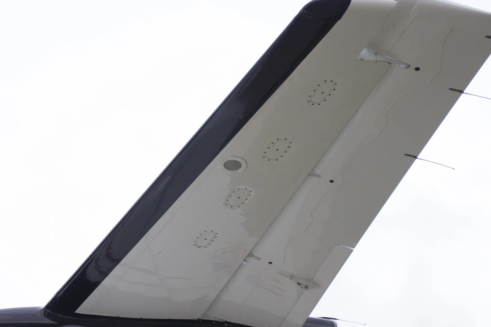 PWI LED logo light &mdash; aircraft wing underside outdoors