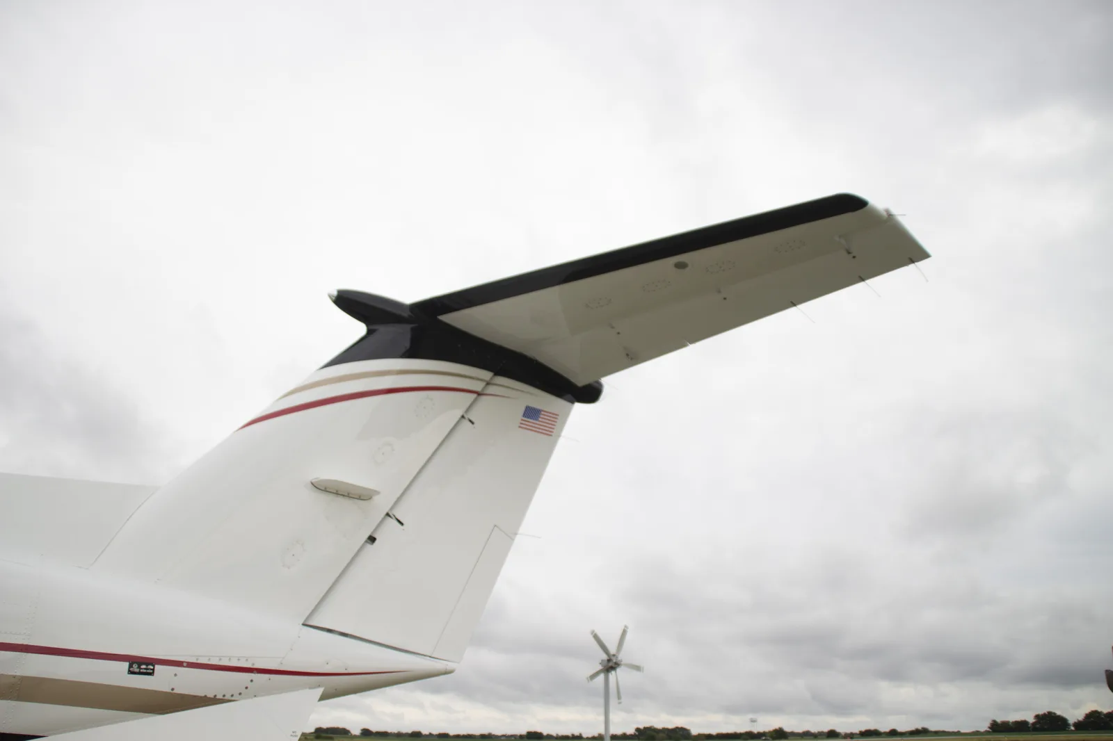 PWI LED logo light &mdash; aircraft tail and wing, exterior view