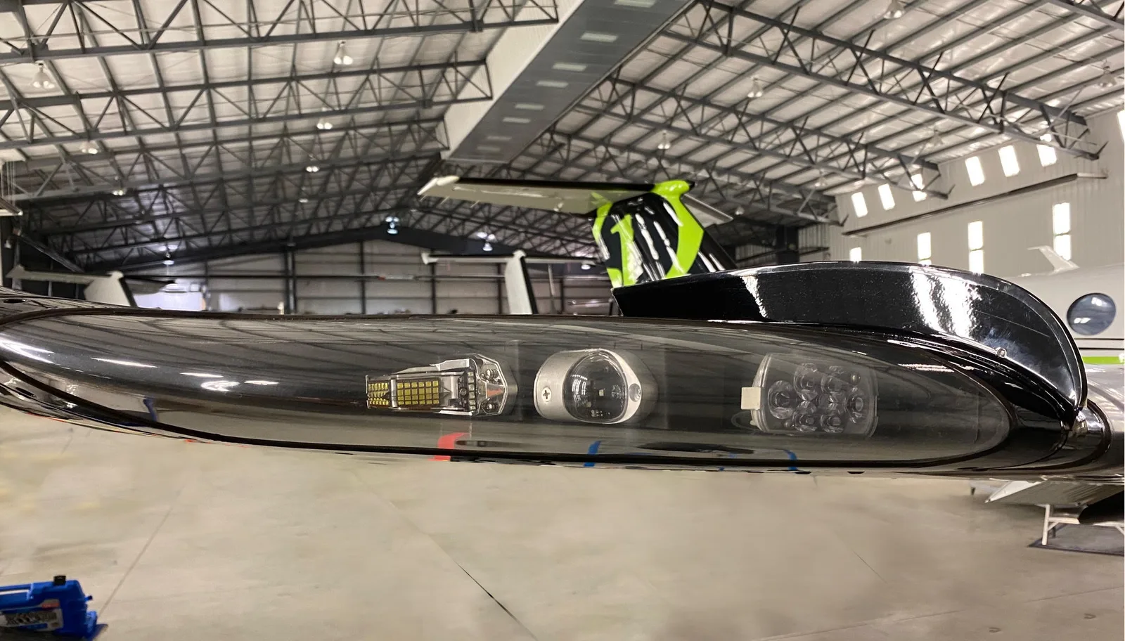PWI LED wingtip light assembly &mdash; installed wingtip lens close-up in hangar