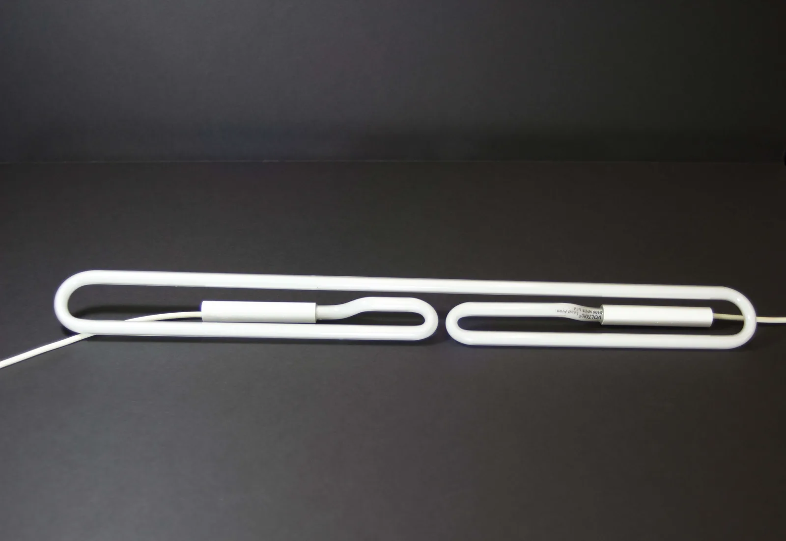 Complex fluorescent light shapes are only achievable by hand-forming the glass.