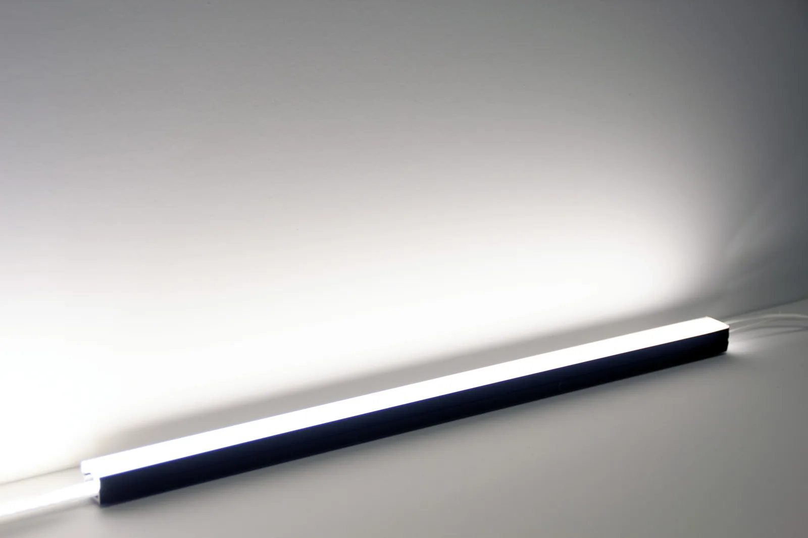 PWI LED linear light &mdash; illuminated strip, studio angle view