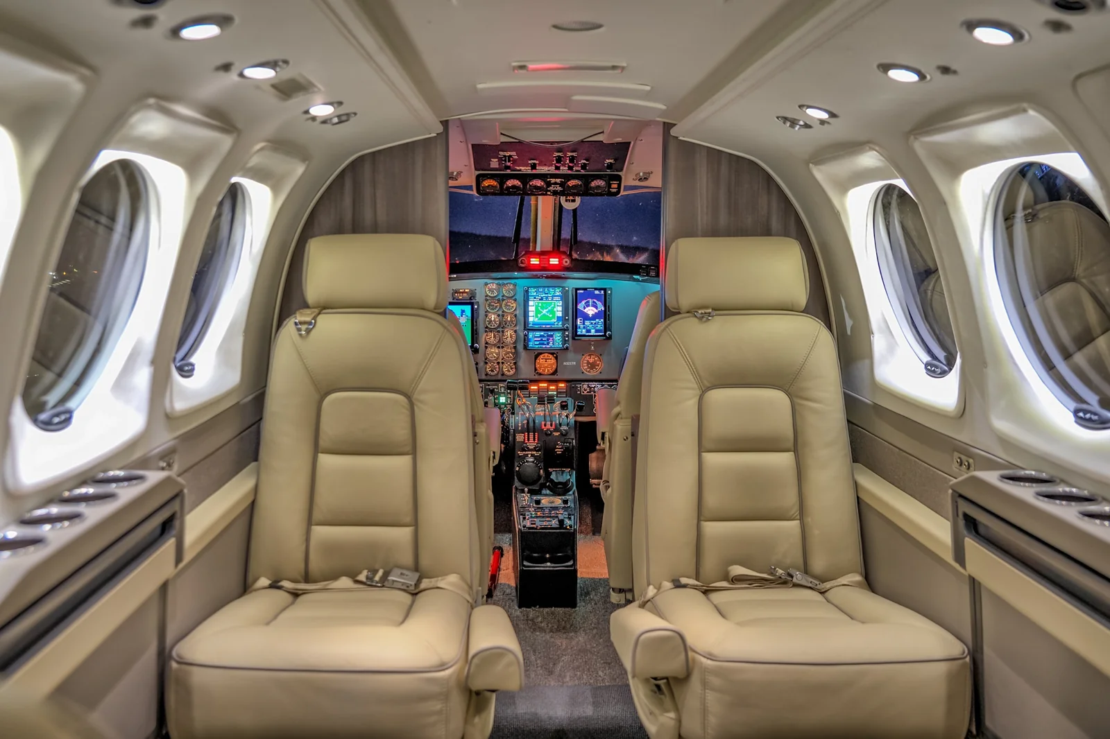 PWI 303 LED reading lights illuminated in King Air cockpit at night