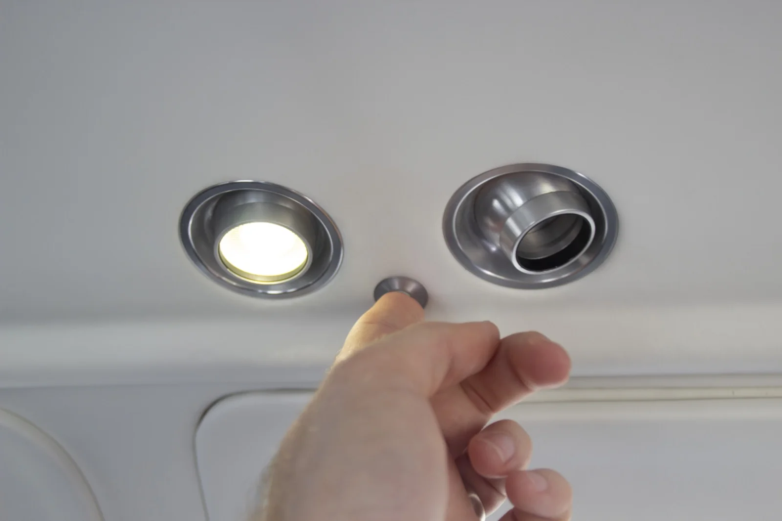PWI 303 LED reading lamp in aircraft cabin overhead panel