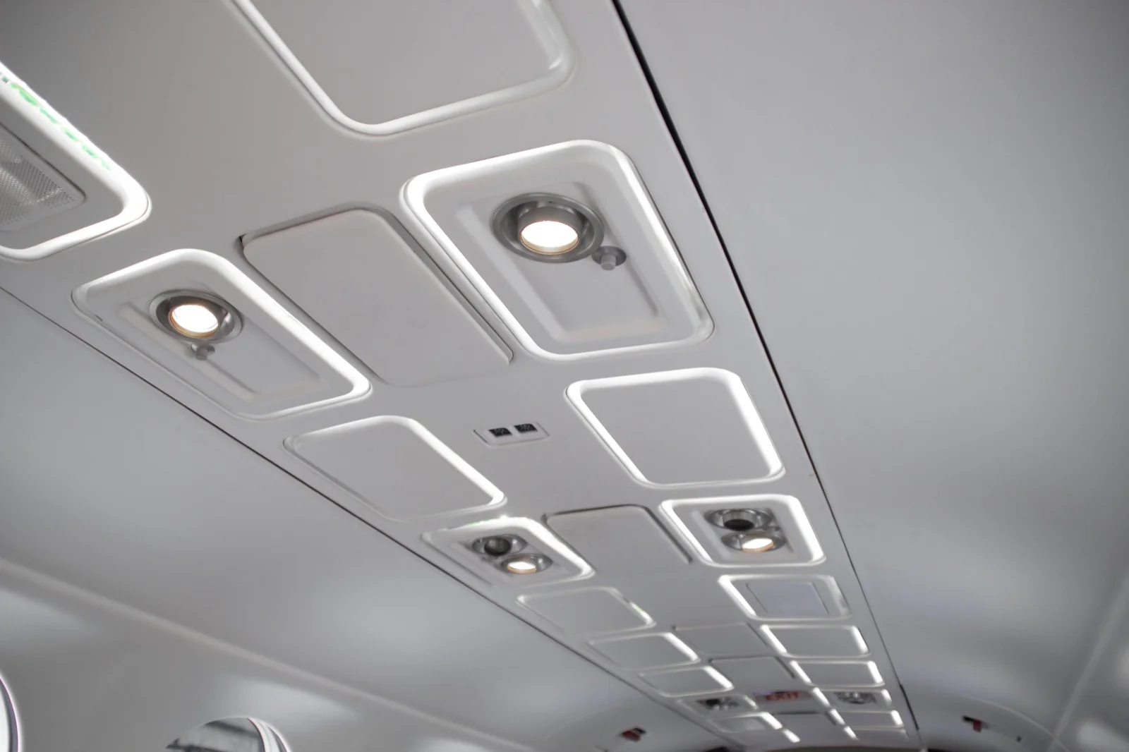 PWI 1495 LED Reading Light &mdash; illuminated round LED fixtures installed in aircraft cabin overhead panel