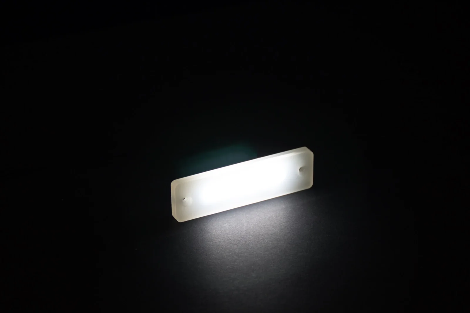 PWI Citation LED step light &mdash; illuminated product shot, angled view
