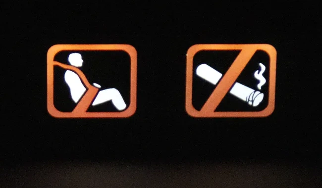 Illuminated seat belt and no-smoking sign showing the LED backlight in use